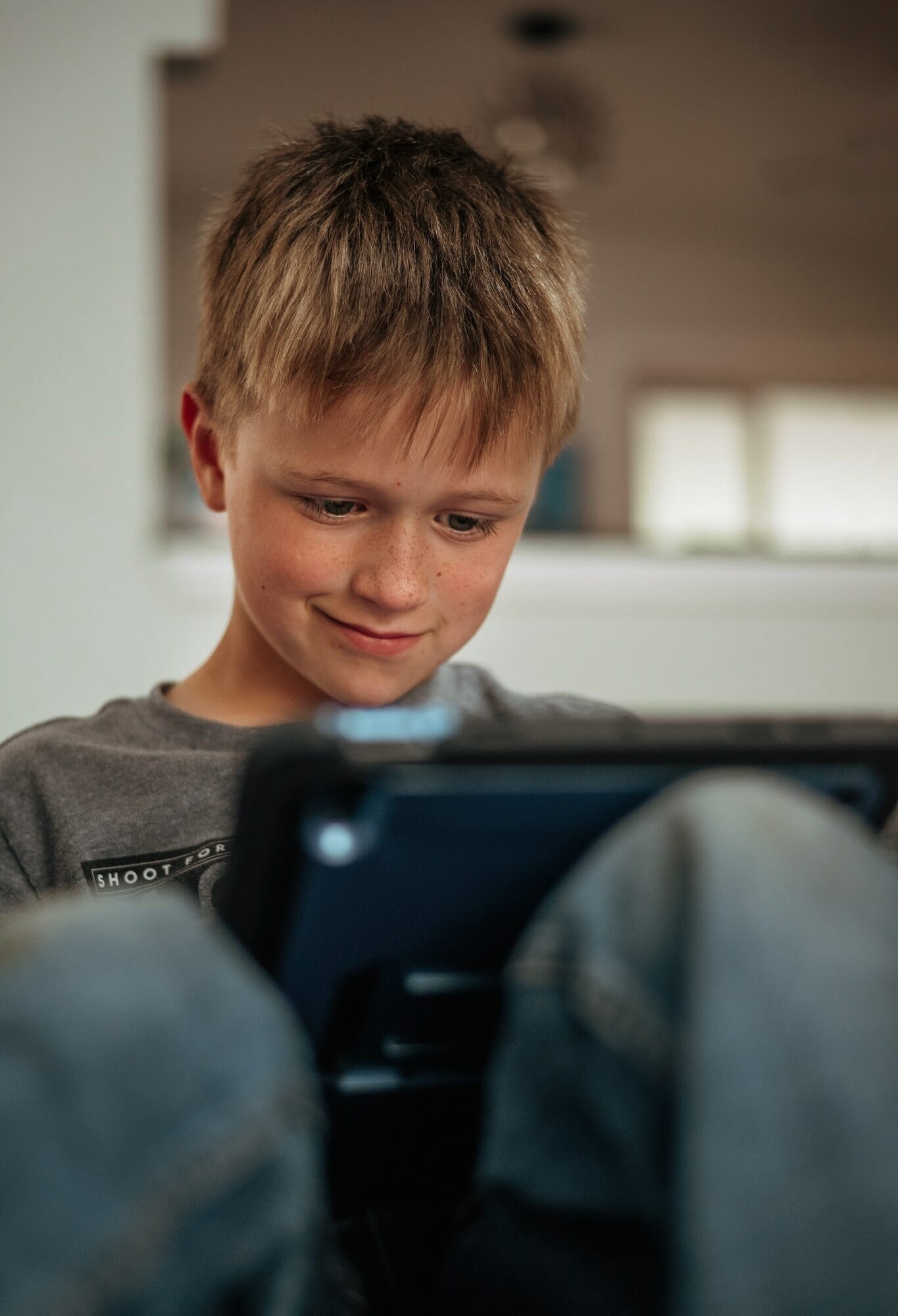 Young child using his tablet