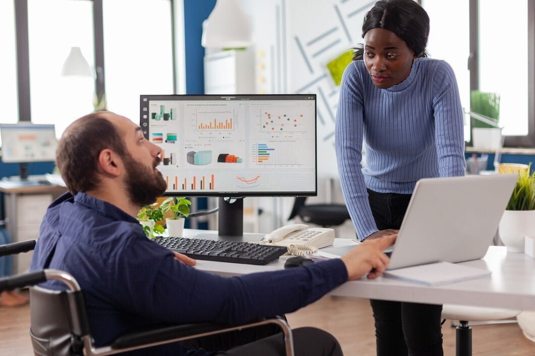 Professional man showing market insights of games to his colleague