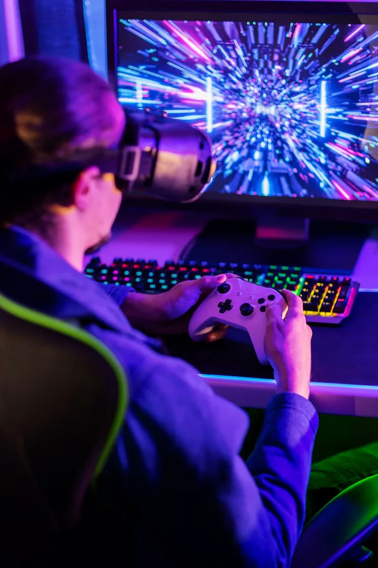 Gamer experiencing immersive gameplay with a VR headset and game controller, showcasing advanced game development.
