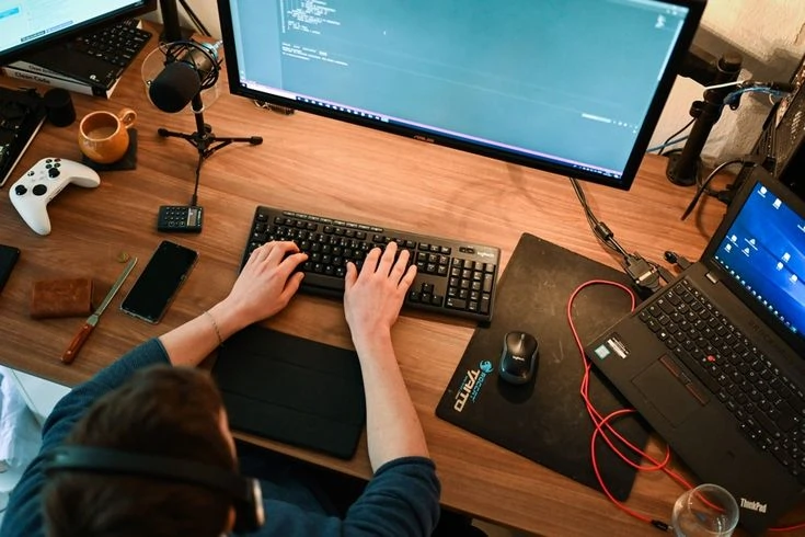 Game developer creating interactive Roblox features