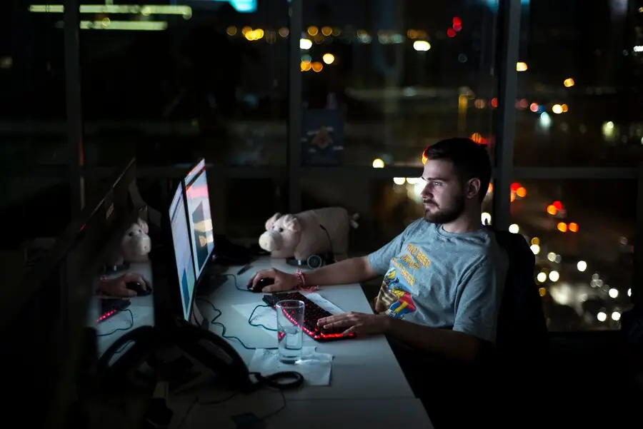 HTML5 Game Development Agency HTML5 Game Development Agency with developer working on a game project.