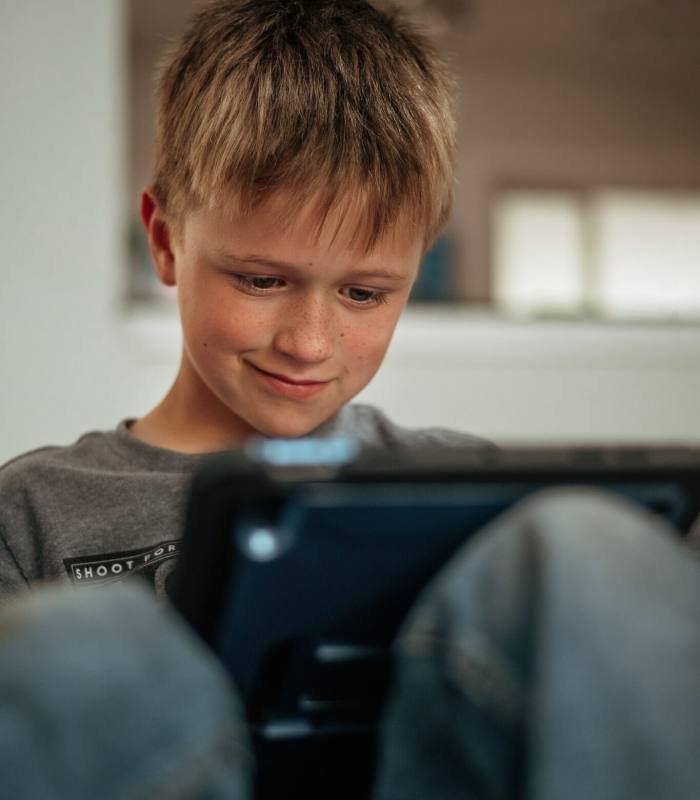 Young child using his tablet