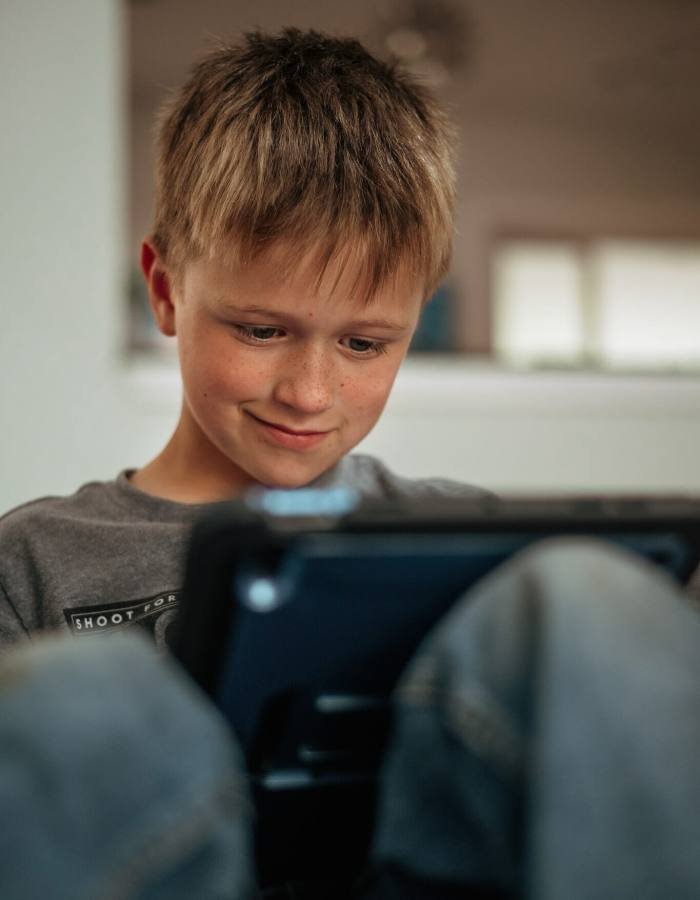 Young child using his tablet