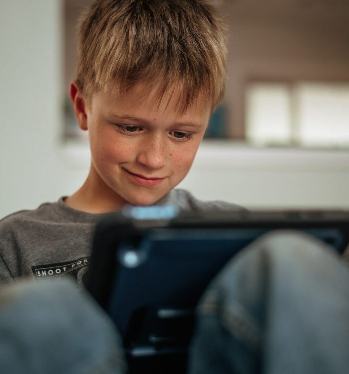Young child using his tablet