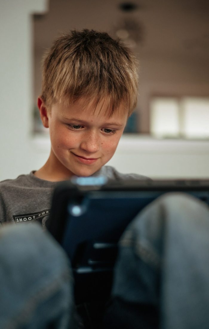 Young child using his tablet