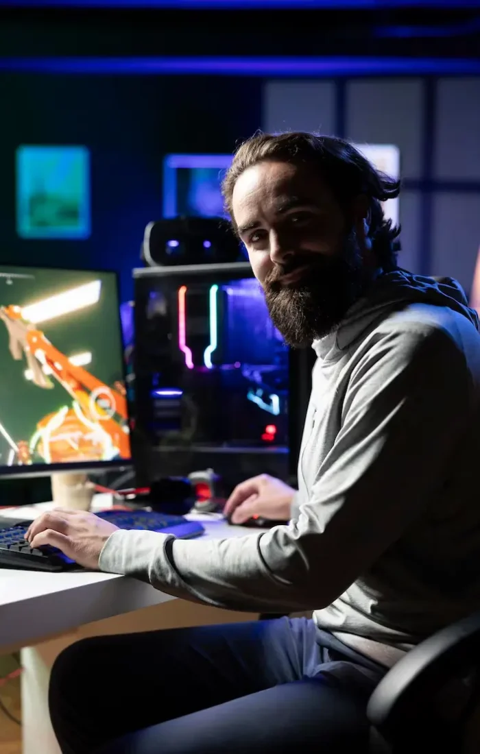 close-up-cheerful-gamer-streaming-game-neon-lit-studio_482257-116067 (1)