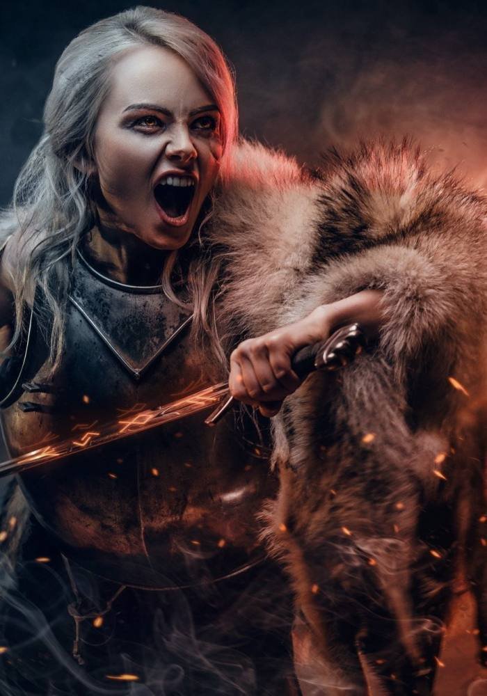 fantasy-woman-wearing-cuirass-and-fur-holding-a-sword-and-rushes-into-battle-with-a-furious-cry.jpg