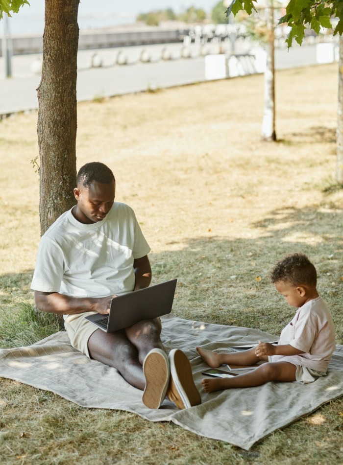 Father Working in Park with Son