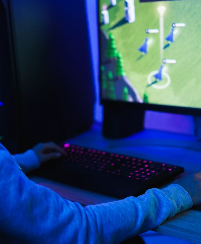 Girl gamer playing at strategy game online