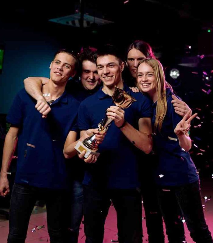 Indie Game Development in London Creating Engaging and Rewarding Play Gaming team celebrating victory, representing indie game development success in London.