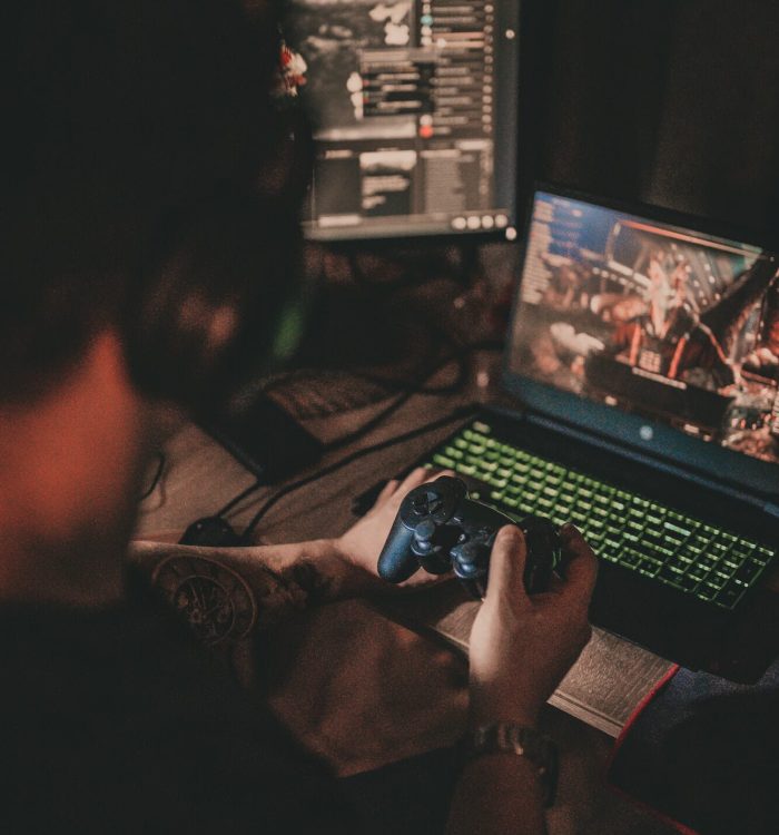 Gamer playing an immersive computer video game on a top-tier setup
