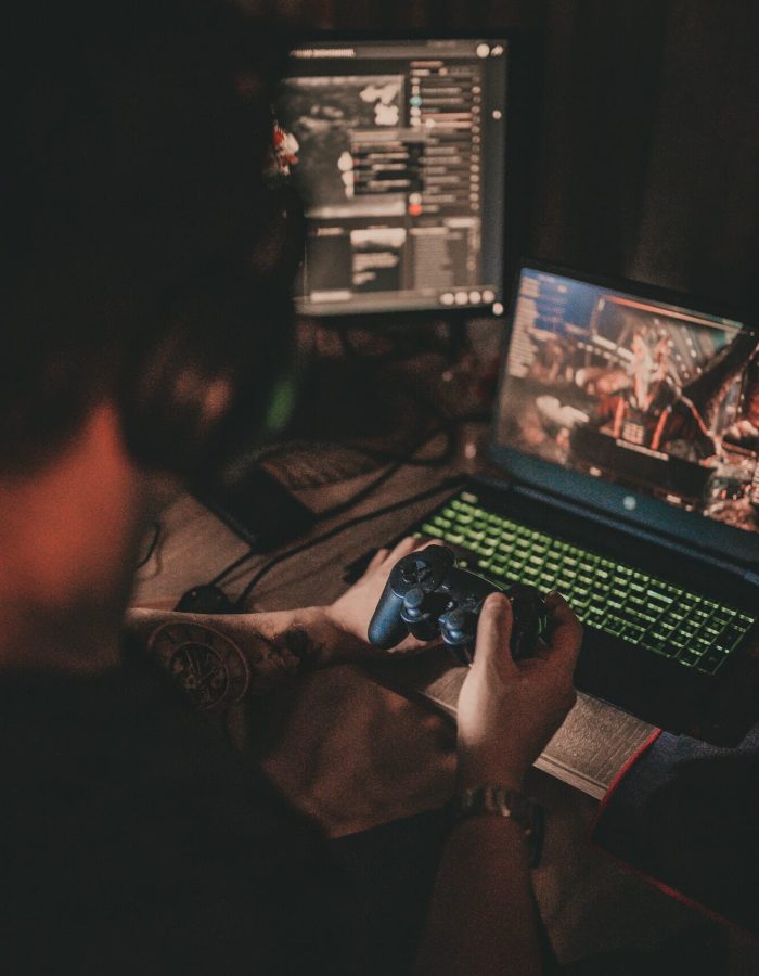 Gamer playing an immersive computer video game on a top-tier setup