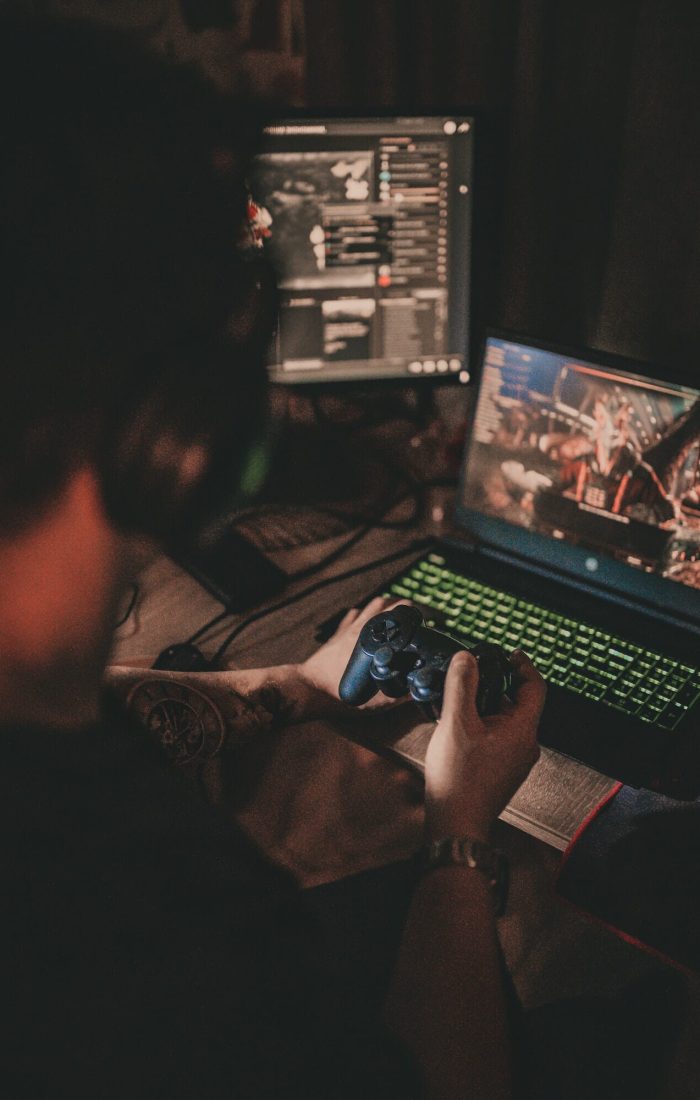 Player fully engaged in computer video games on a powerful system Gamer playing an immersive computer video game on a top-tier setup
