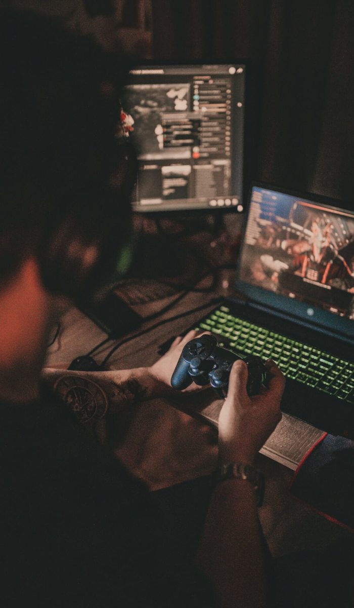 Player fully engaged in computer video games on a powerful system Gamer playing an immersive computer video game on a top-tier setup