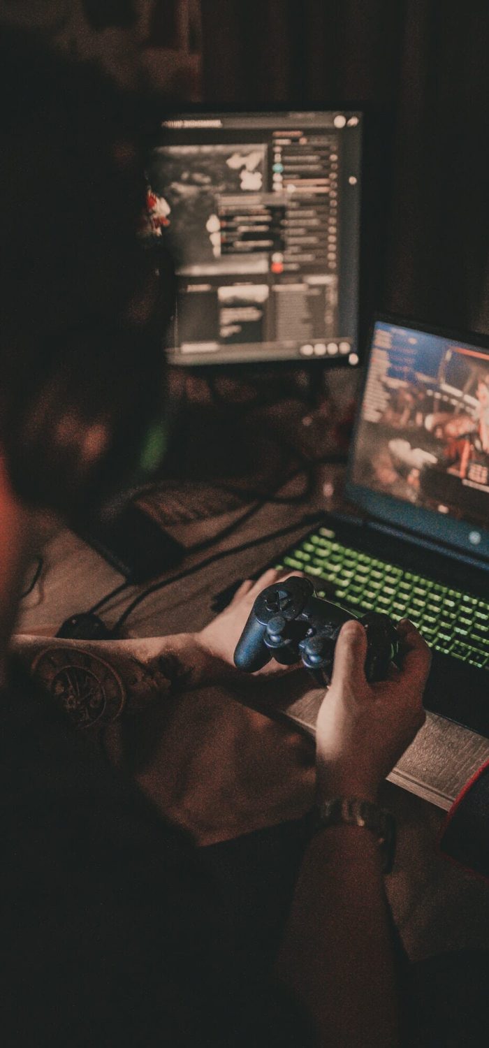 Gamer playing an immersive computer video game on a top-tier setup