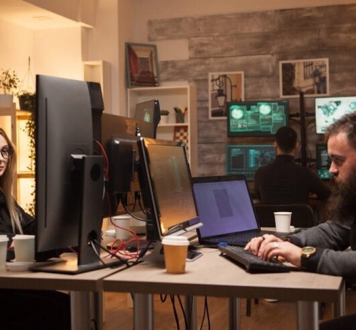 Bearded man playing a 3D game on a desktop