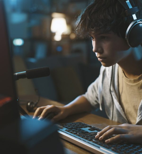 Young gamer testing a newly built Graphic Adventure Game Development title