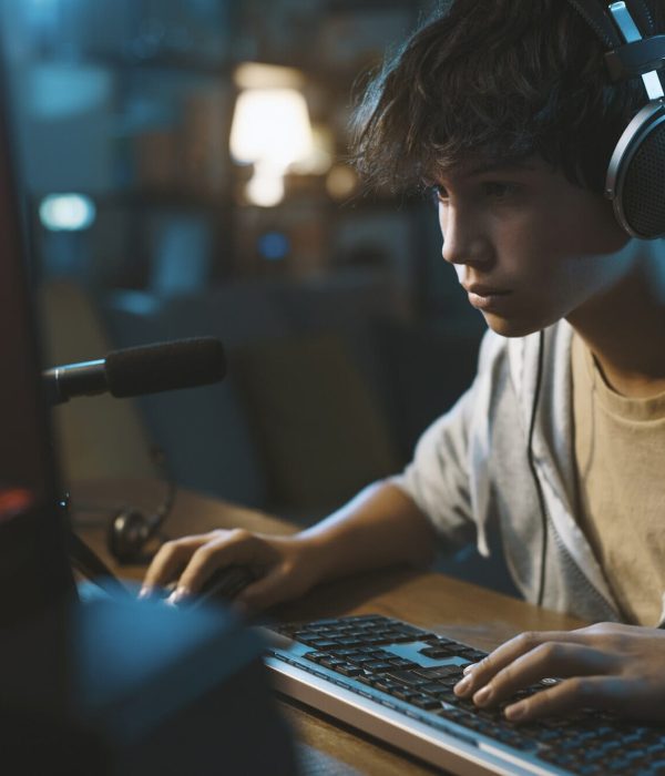 Young gamer testing a newly built Graphic Adventure Game Development title