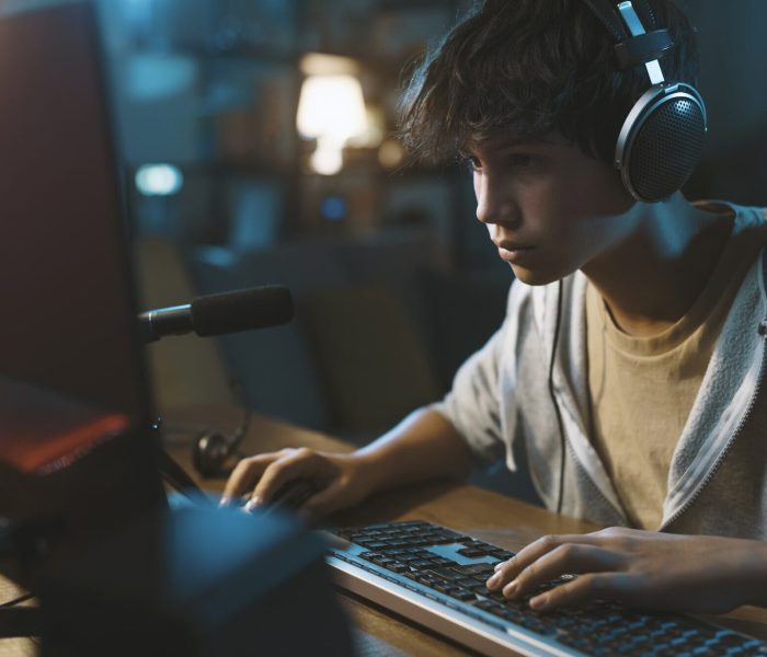 Young gamer testing a newly built Graphic Adventure Game Development title